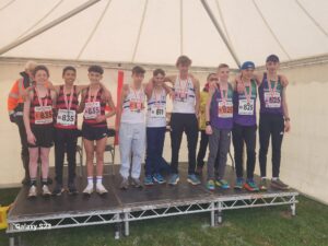 Teams on podium with medals